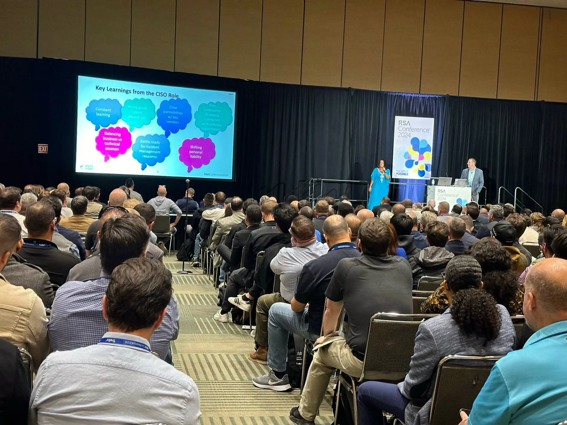 Dan Gorecki presenting to a full conference room